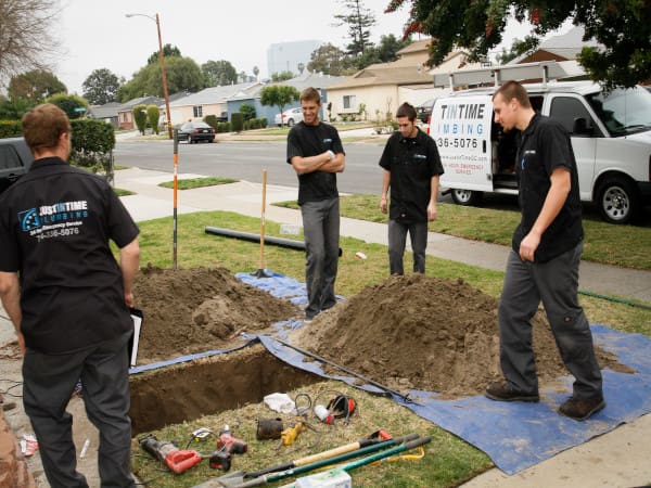 JustinTime crew and branded van at a dig site